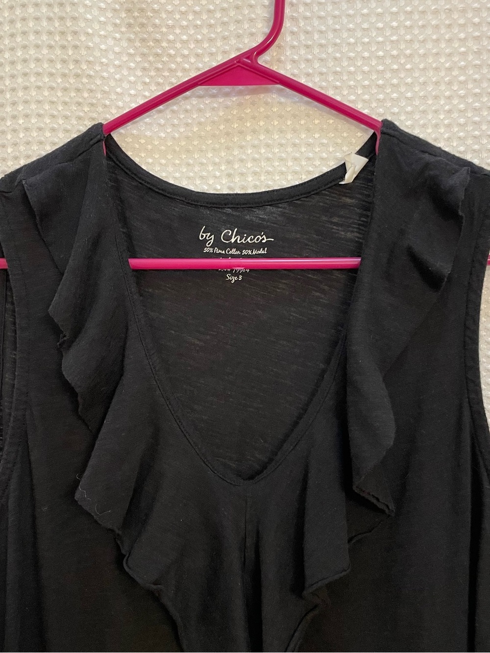 Chico’s ruffle V Neck black tank top. Size 3